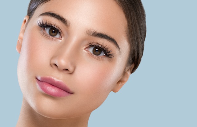 Close-up of curled, tinted lashes after a lash lift, no mascara