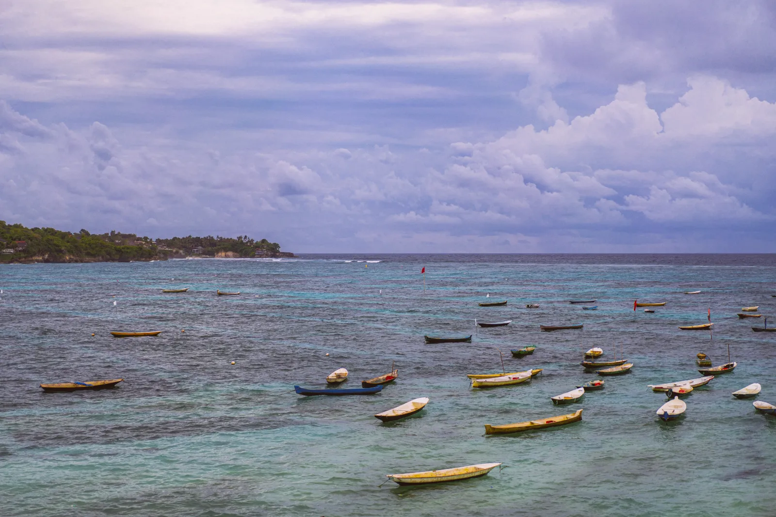 Traditional boats at sunset off Nusa Lembongan, Bali